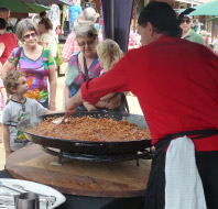 Spanish gluten free and healthy Paella cooking at a family friendly festival in Australia.